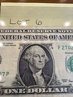 Obverse of the 1999 $1 bill showing portrait, serial number F27027373P