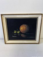 Frontal shot of framed painting showing subject and signature