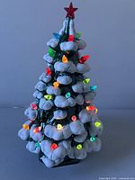 Full view of ceramic Christmas tree lamp lit