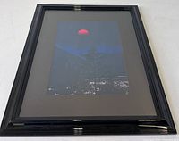 Front view of framed photograph showing image, mat, and frame