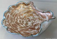 Top view showing gold aventurine speckles and blue rim