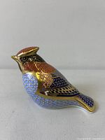 Left side view showing full waxwing paperweight and pattern