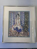 Full view of framed Matisse print on table