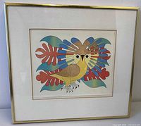 Front view of framed print showing image, mat and brass-tone frame