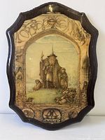 Full view of plaque showing shape, illustration and frame