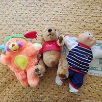 Group shot of the three 1980s plush toys