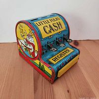 Front view showing LITTLE FOLKS CASH, register drawer, numbered keys