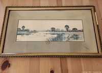 Full view of framed watercolour landscape under glass