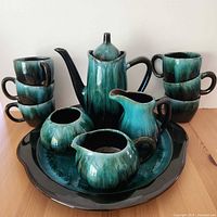 Full view of Blue Mountain Pottery set showing teapot, mugs, creamer, sugar bowl, small bowl and tray