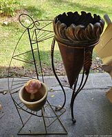 Group shot of plant stand, metal cone planter, ceramic pot, mushroom
