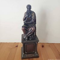 Full view of bronze-tone Plato statue on pedestal