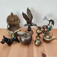 Group shot of all nine brass and metal decor items