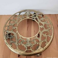 Top view of ornate brass plant stand