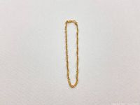 Full view of gold rope chain bracelet