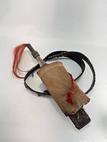 Dagger in scabbard attached to belt