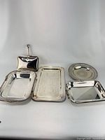 Group shot of all five silver-plated pieces
