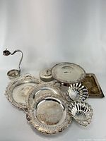 all nine silver-plated pieces grouped