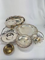 Group shot of eight silver-plated serving pieces
