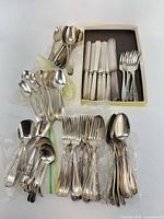 Overview of assorted flatware pieces grouped together