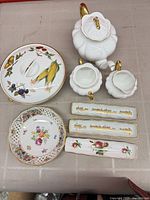 Group shot of all eight porcelain pieces laid out