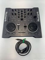 Top view of Numark Stealth Control DJ controller with USB cable