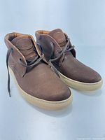 Three-quarter front view of both sneakers showing overall design and condition