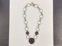 Full view of sterling silver necklace laid flat