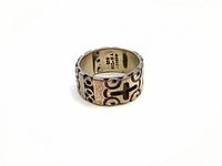 Sterling silver band ring showing exterior cross and circle design