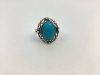 Front view of sterling silver ring with turquoise cabochon
