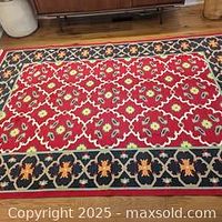 Full view of wool kilim rug showing pattern and colors