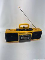 Front view of yellow Sony Sports 980 boombox with antenna extended