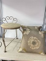 Vanity stool and pillows side by side