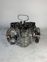 Full set in chrome caddy with glasses and coasters in place