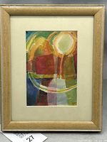 Full view of framed watercolor under glass