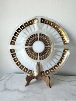 Front view of Fred Press platter on stand