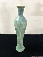 Full view of tall earthenware vase