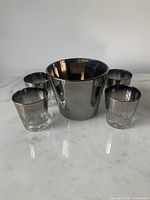 Full set: ice bucket centered with four tumblers around
