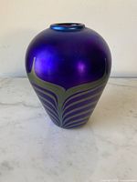 Front view of iridescent cobalt pulled feather vase