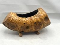 Full view of bamboo root pot on two feet