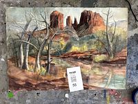Full view of watercolor painting on workspace showing Cathedral Rock scene