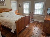 Full view of bed frame assembled with mattress in bedroom