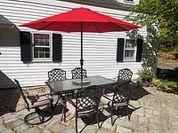 Dining set with umbrella assembled on patio