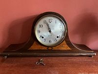 Front view of Sessions tambour mantel clock with dial and key shown