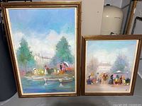 Both framed paintings side by side showing relative sizes and gold-tone frames