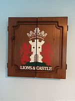 Front of closed cabinet showing Lions & Castle crest