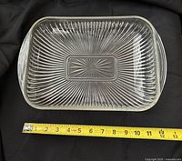 Top view showing starburst centre and radiating ribs, tape measure indicating length