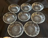 All eight smaller bowls arranged to show pattern