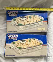 two Queen Anne product boxes showing casserole server image and branding
