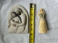 Front view of both items with tape measure for scale