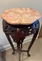 Top view showing removable pink marble inset and carved apron